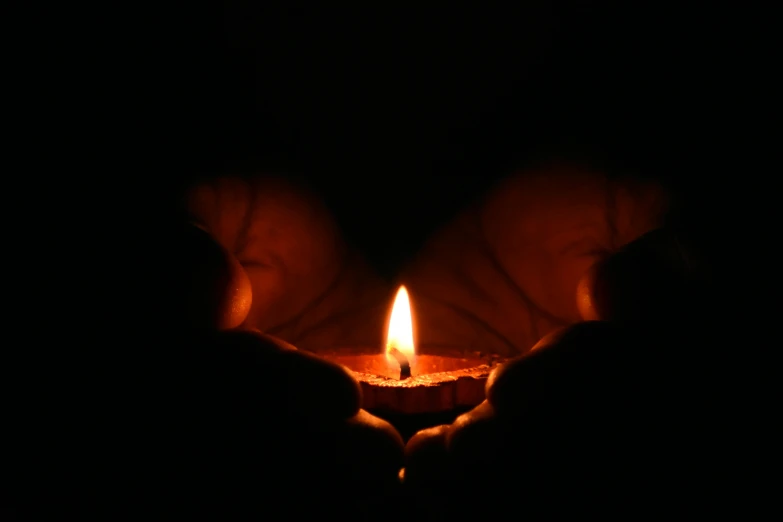 a person holding a lit candle in their hands, by Daniel Lieske, hurufiyya, awareness, fan favorite, hands pressed together in bow, profile image