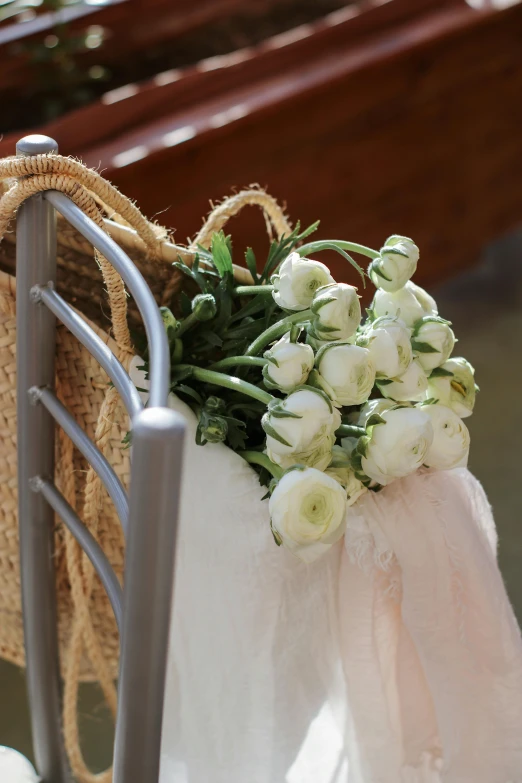 a close up of a chair with a bunch of flowers on it, pews, silver，ivory, lightweight, no cropping