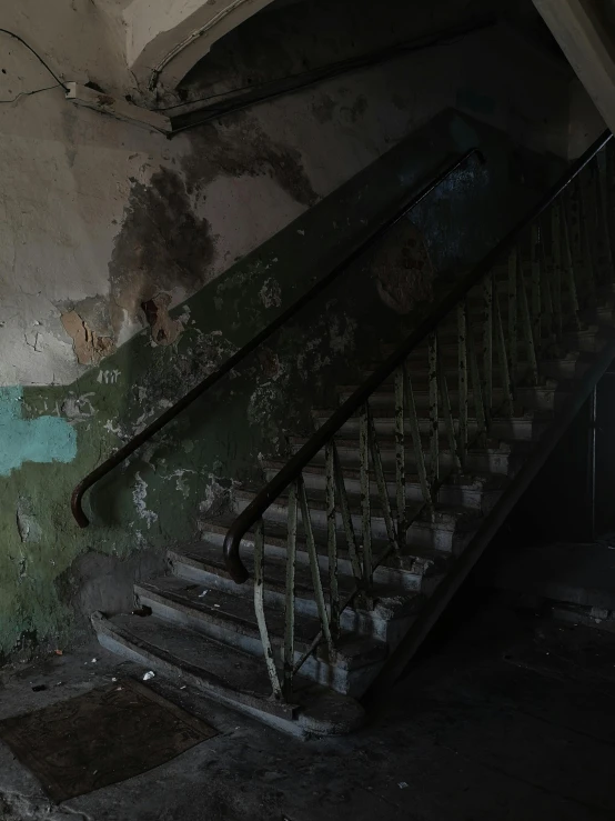 a set of stairs in a run down building, inspired by Elsa Bleda, pexels contest winner, ( apocalyptic ) 8 k, фото девушка курит, indoor picture, spooky found footage