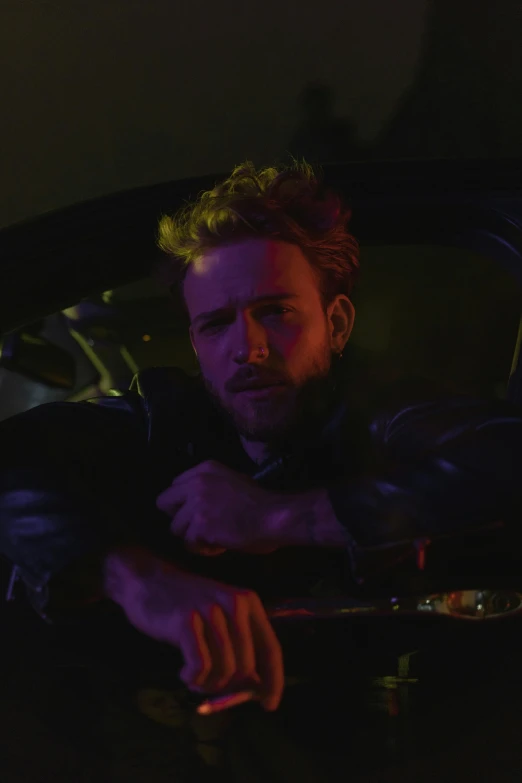 a man sitting in the driver's seat of a car, an album cover, inspired by Vincent Lefevre, logan, intense smoldering, gif, ( ( theatrical ) )