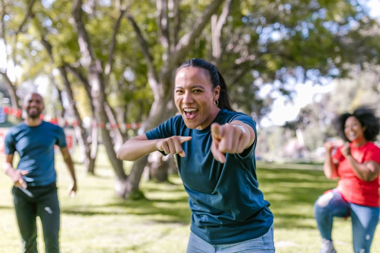 a group of people playing frisbee in a park, a portrait, pexels contest winner, happening, giving a thumbs up to the camera, woman holding another woman, te pae, profile picture