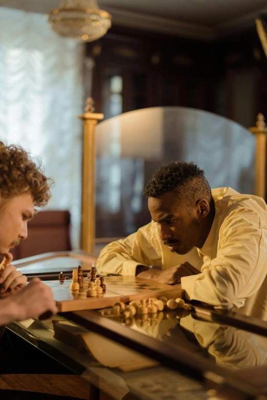 two men playing chess in a living room, a portrait, unsplash, renaissance, movie still of a tired, in a gold suit, rubens, stained”