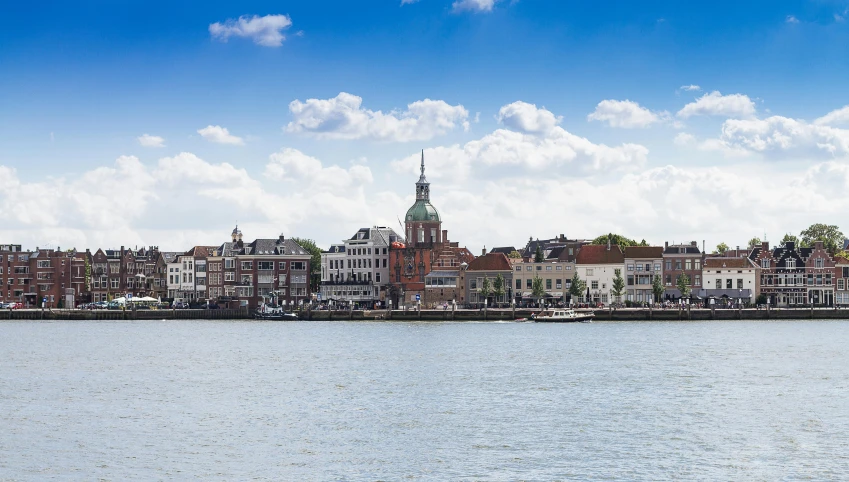 a large body of water with buildings in the background, a picture, by Jan Tengnagel, gigapixel photo, high quality image”, bright sky, naval landscape