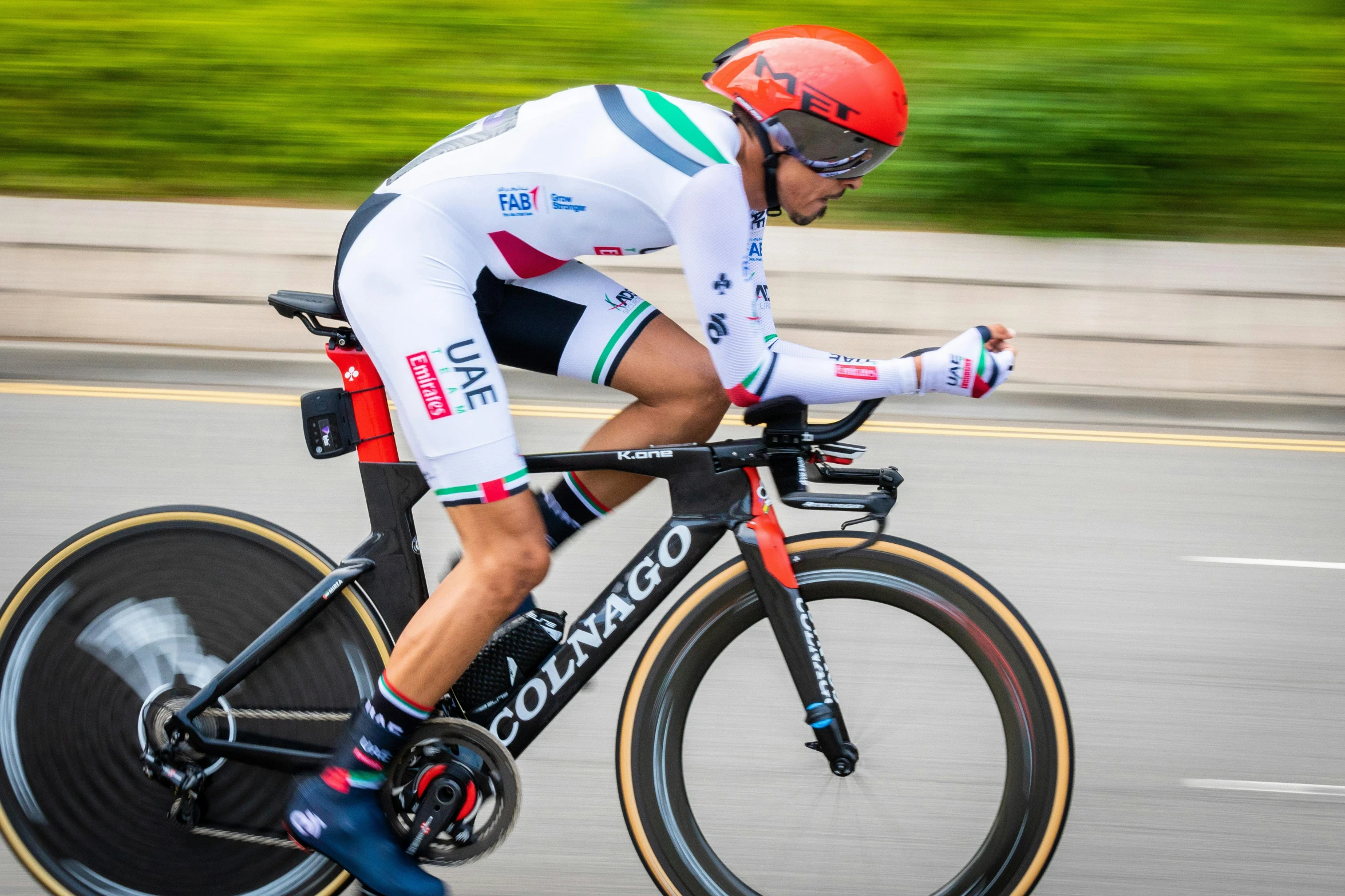 a man riding a bike down a street, unsplash, shin hanga, in a race competition, skintight suits, profile image, italian