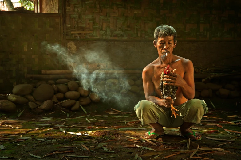 a man sitting on the ground smoking a pipe, inspired by Rudy Siswanto, sumatraism, lpoty, the chicken man, holding green fire, intermediate art