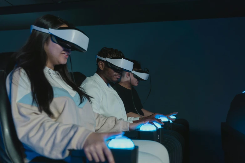 a group of people wearing virtual reality headsets, a hologram, pexels, in-game cinematic, sitting down, avatar image, [ theatrical ]