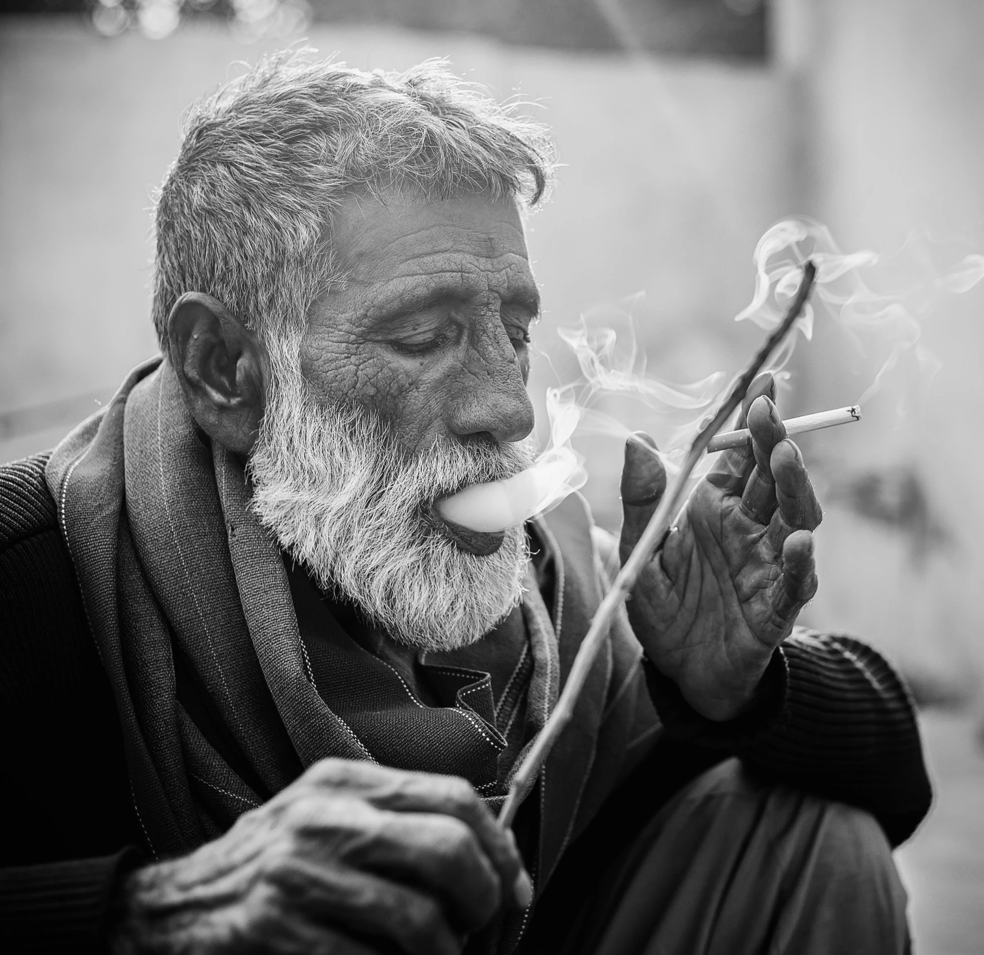 a black and white photo of a man smoking a cigarette, a black and white photo, by Rajesh Soni, pexels contest winner, overalls and a white beard, outside alone smoking weed, smoking a magical bong, ganja