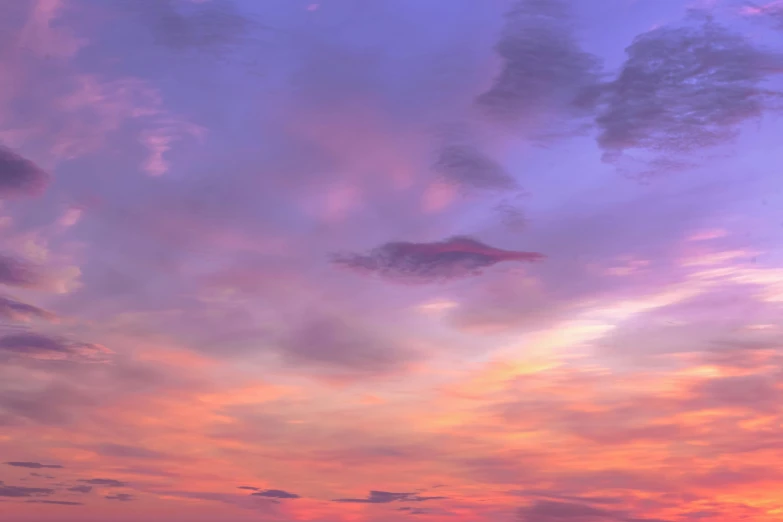 a large body of water under a cloudy sky, an album cover, inspired by Frederic Church, pexels contest winner, romanticism, purple sunset, pink, beautiful composition 3 - d 4 k, multicolored