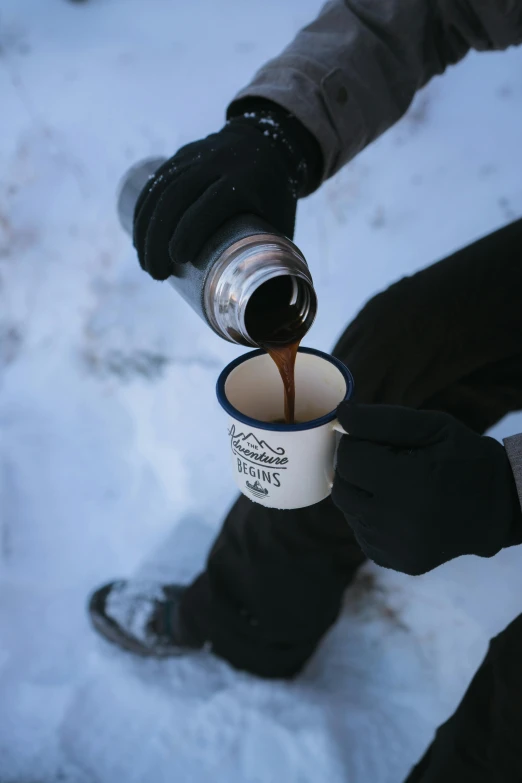 a person pouring coffee into a cup in the snow, inspired by Muggur, dark brown, pbr, adventure gear, f / 2 0