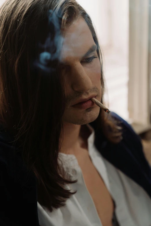 a man with long hair smoking a cigarette, an album cover, inspired by Nan Goldin, trending on unsplash, renaissance, inspired in balthus, drag, movie scene close up, julian ope