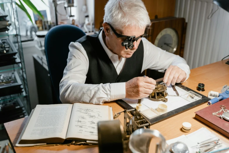 a man sitting at a desk working on a watch, an engraving, by Konrad Witz, pexels contest winner, specimens in glasses, gilt-leaf winnower, thumbnail, anato finnstark and kelogsloops