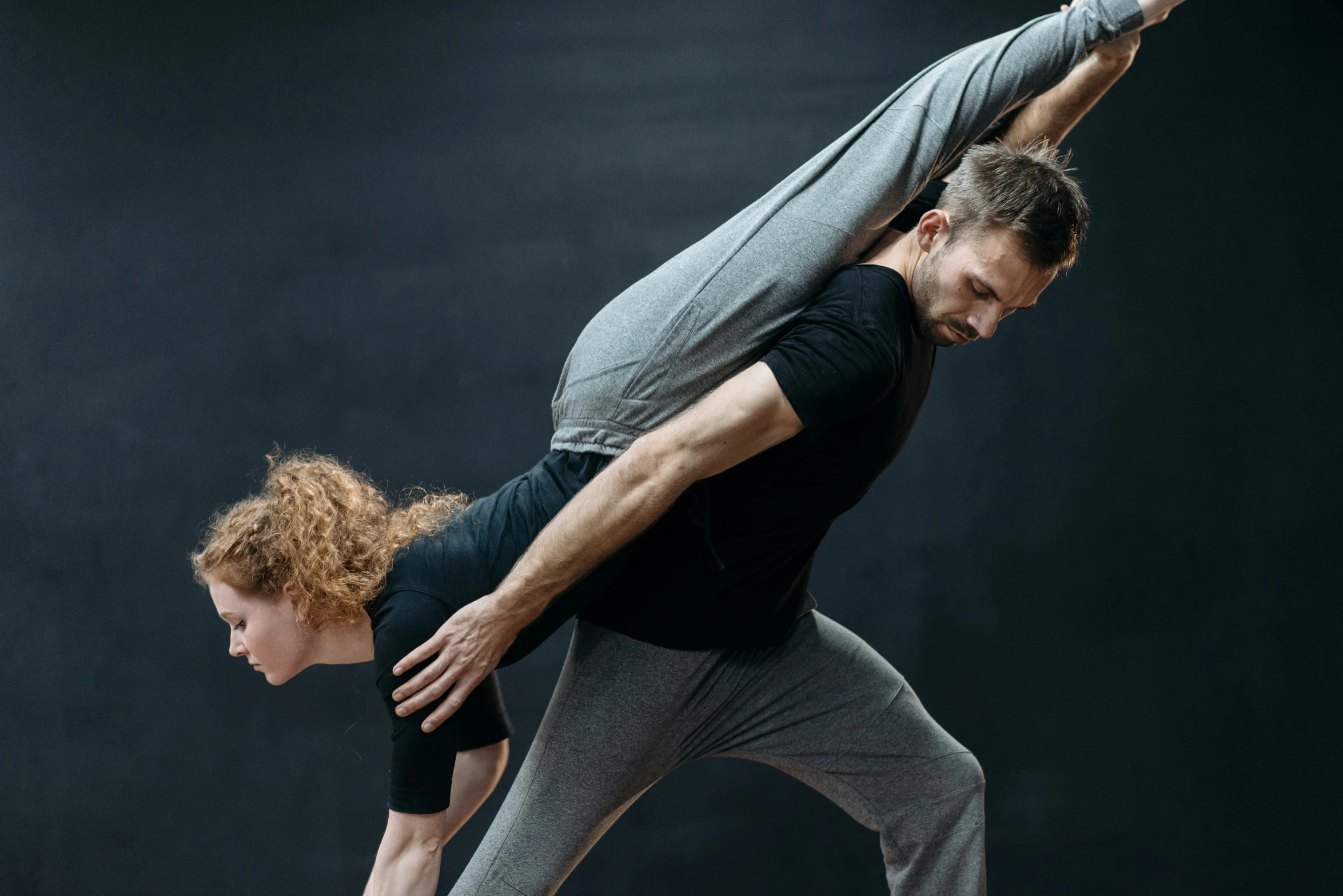 a man and a woman doing a yoga pose, by Matija Jama, arabesque, profile image, square, dynamic stretching, sydney hanson