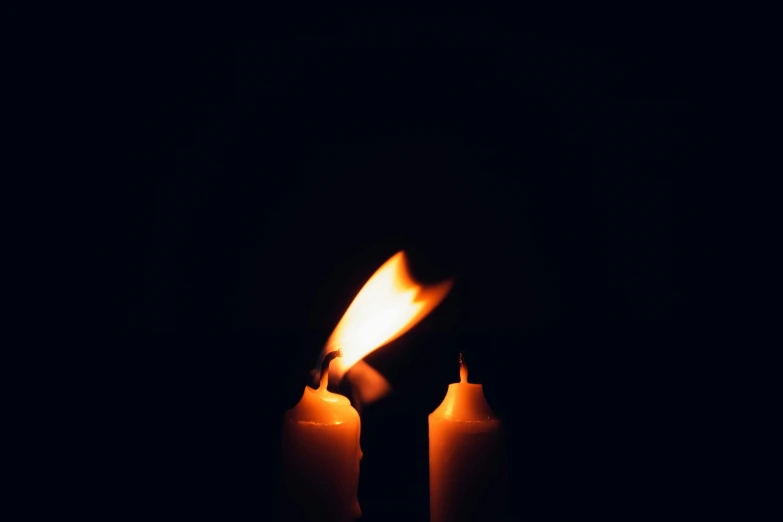 a close up of a lit candle in the dark, an album cover, pexels, instagram post, mourning, multiple flames, profile image