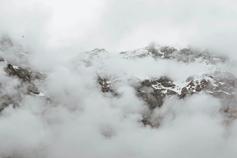 a group of people standing on top of a snow covered mountain, low clouds after rain, background image, computer wallpaper, grey