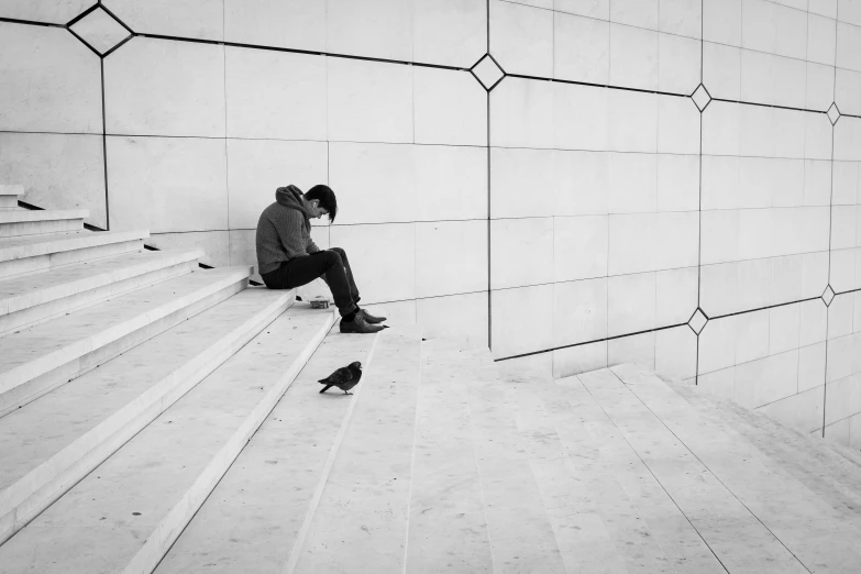 a black and white photo of a person sitting on some steps, by Pierre Mion, unsplash contest winner, squares, broken heart, at a mall, couple