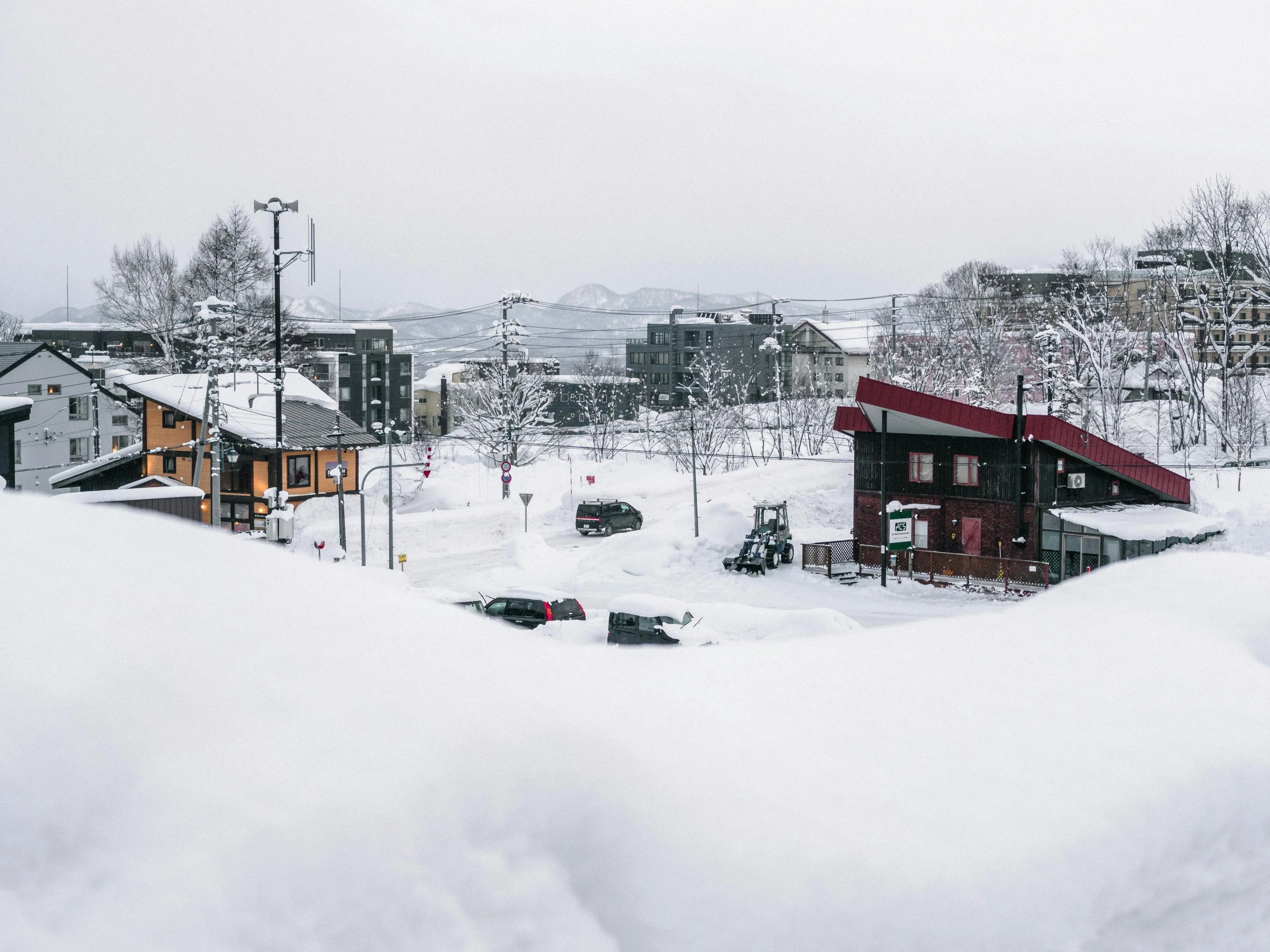 a couple of houses that are in the snow, pexels contest winner, mingei, opposite the lift-shaft, thumbnail, aomori japan, in the distance