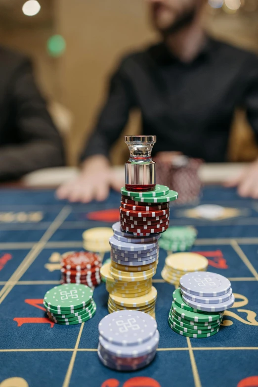 a man sitting at a casino table with stacks of chips, pexels contest winner, renaissance, splash image, thumbnail, polyhedral, high angle close up shot