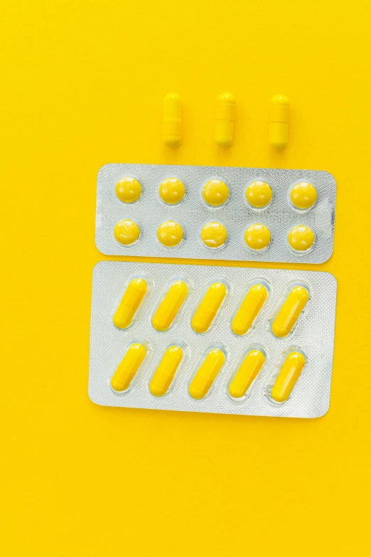 pills in a blister pack on a yellow background, by Adam Marczyński, antipodeans, instagram post, 15081959 21121991 01012000 4k, on a white table, teaser