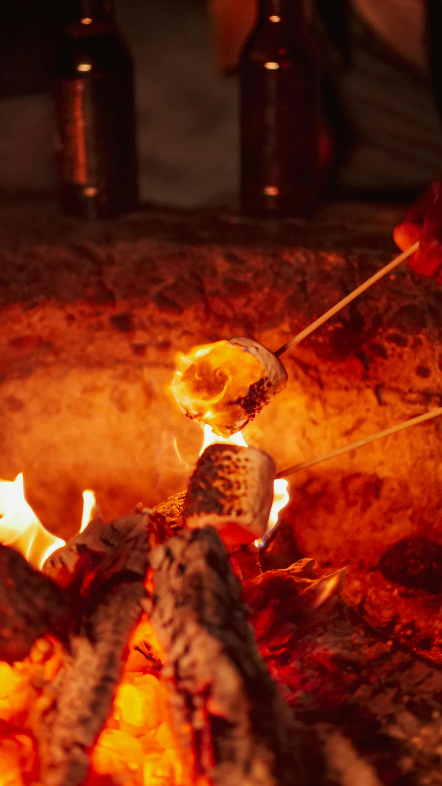 a person roasting marshmallows over an open fire, pexels, coloured in orange fire, food, inside a grand, foil