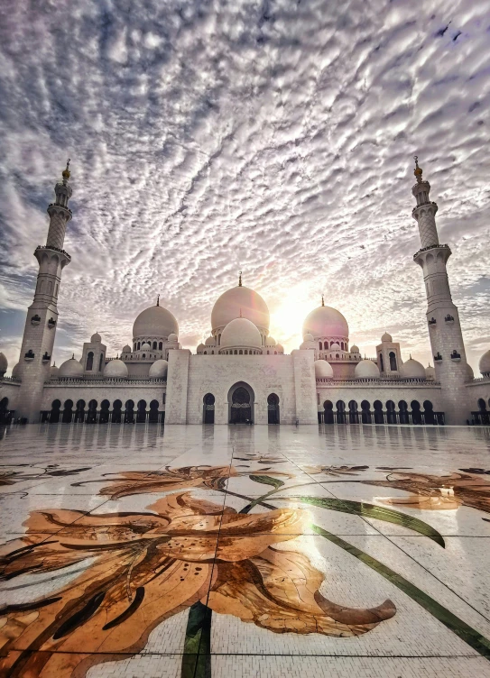 a large white building sitting under a cloudy sky, with beautiful mosques, 8k award-winning photograph, square, intricate ”