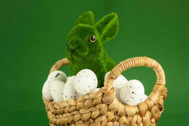 a stuffed rabbit sitting in a basket filled with eggs, unsplash, happening, heavy green, official product photo, screensaver, frank moth