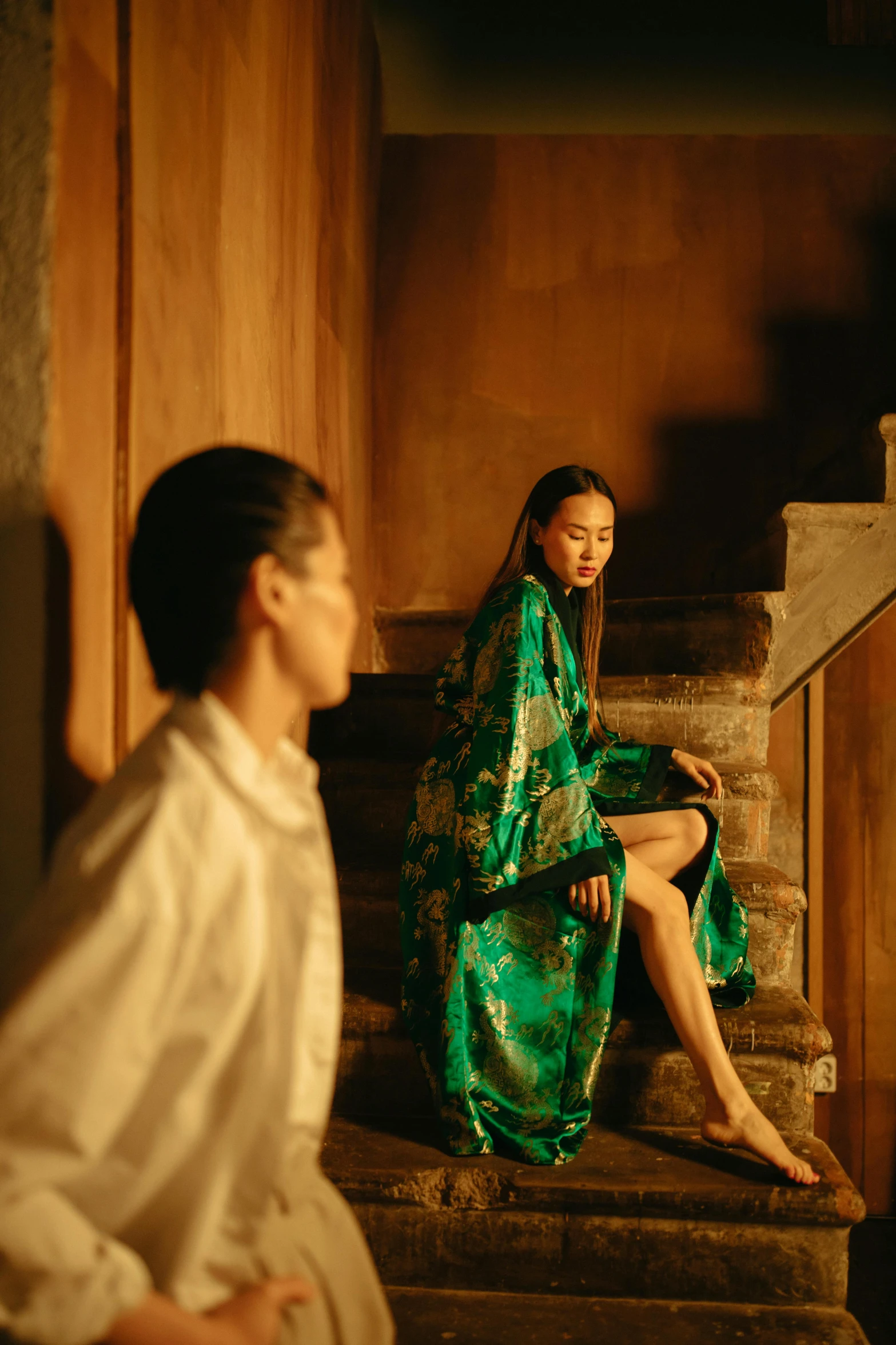 a woman sitting on a set of stairs next to a man, inspired by Fei Danxu, renaissance, green robe, wong kar wai, slide show, holiday