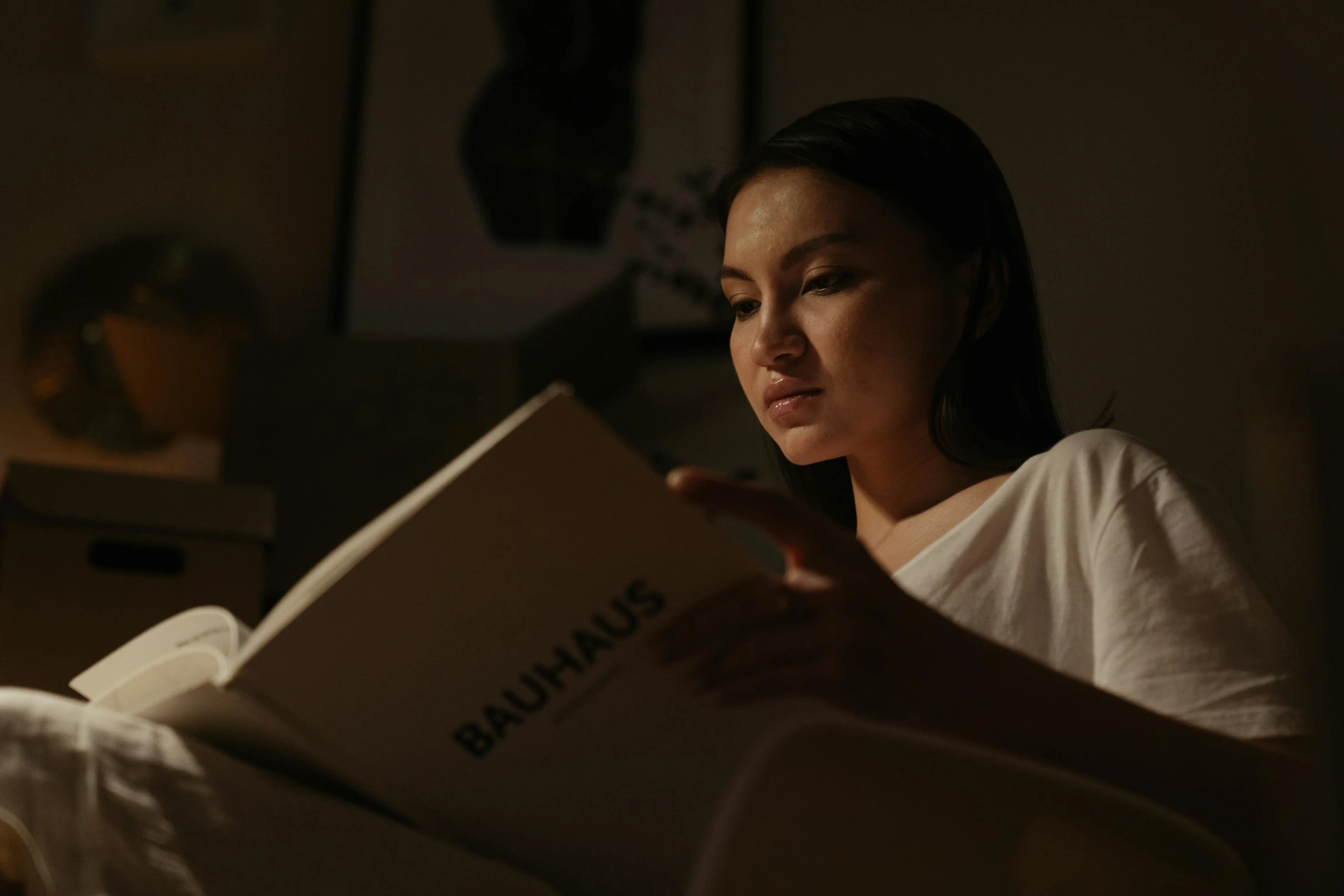 a woman laying in bed reading a book, a portrait, pexels contest winner, bauhaus, calm night. over shoulder shot, avatar image, profile image, asian female