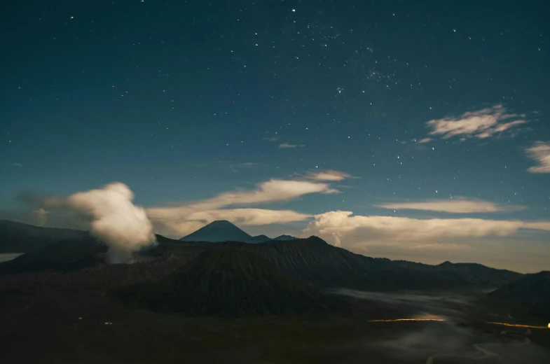 the view from the top of a mountain at night, a matte painting, unsplash contest winner, sumatraism, square, grey, volcanoes, blue