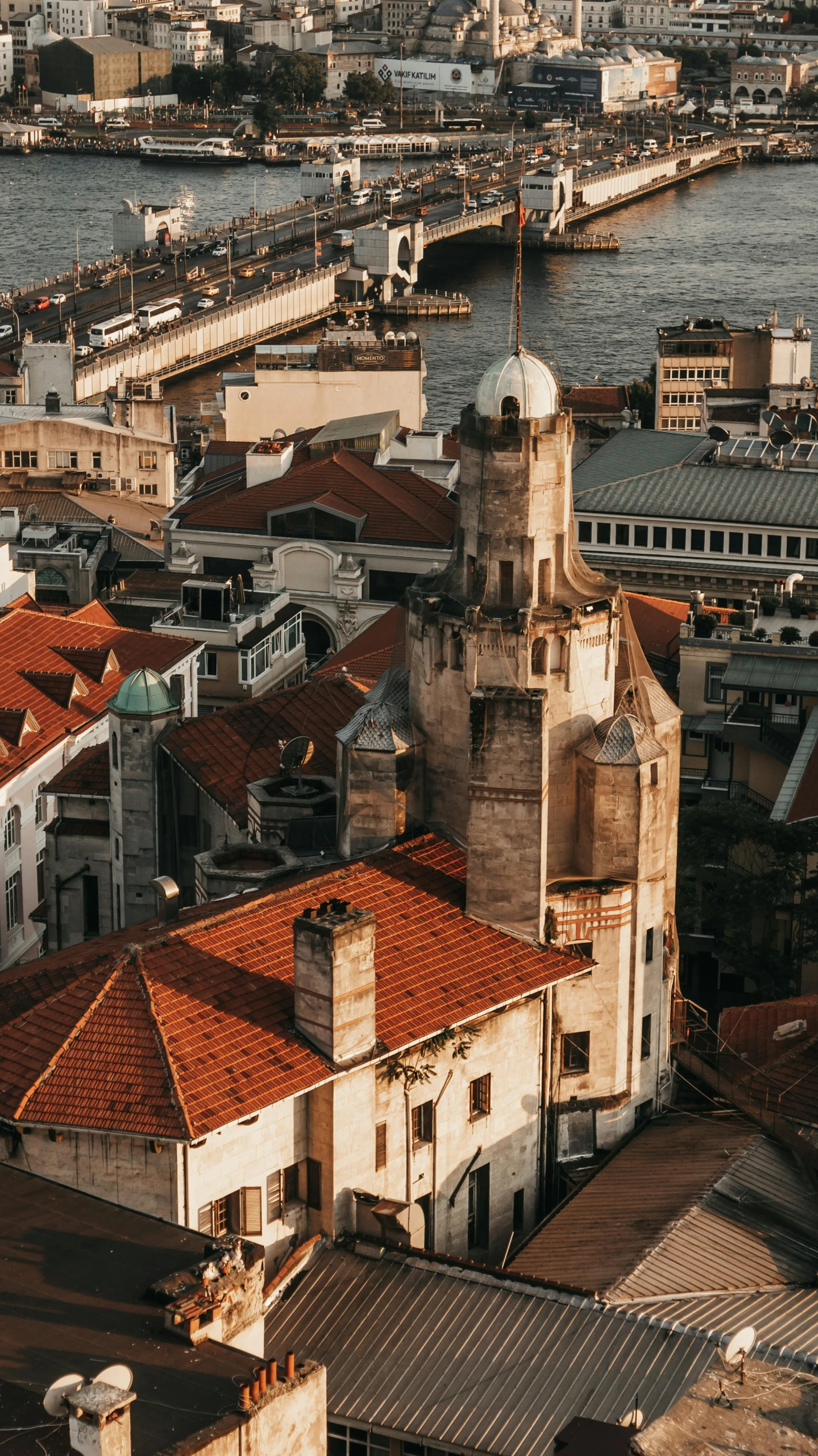 a view of a city from the top of a building, inspired by Almada Negreiros, pexels contest winner, neoclassical tower with dome, an abandoned old, brown, rounded roof