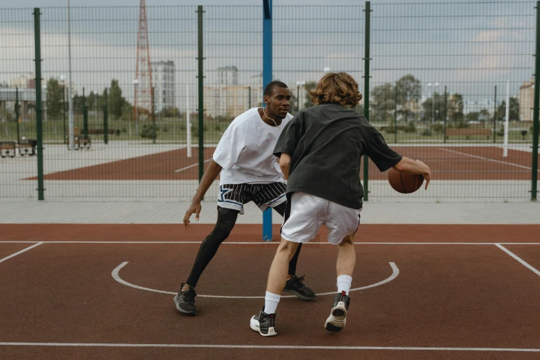 a couple of men playing a game of basketball, trending on dribble, 15081959 21121991 01012000 4k, low iso, private school, mr beast