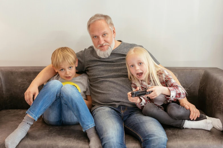 a man and two children sitting on a couch, pexels contest winner, gray beard, video games, avatar image, elderly