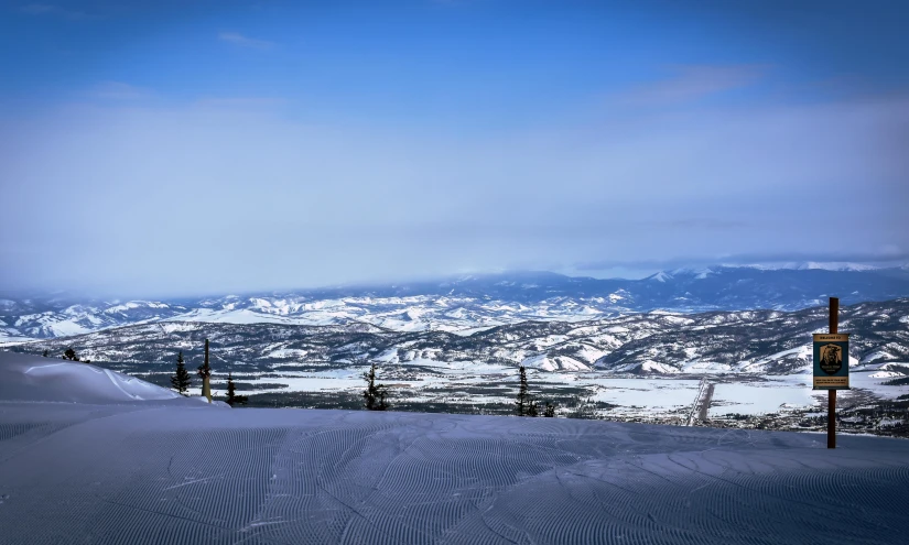 a person riding skis on top of a snow covered slope, pexels contest winner, baroque, valley in the distance, montana, view from far away, thumbnail