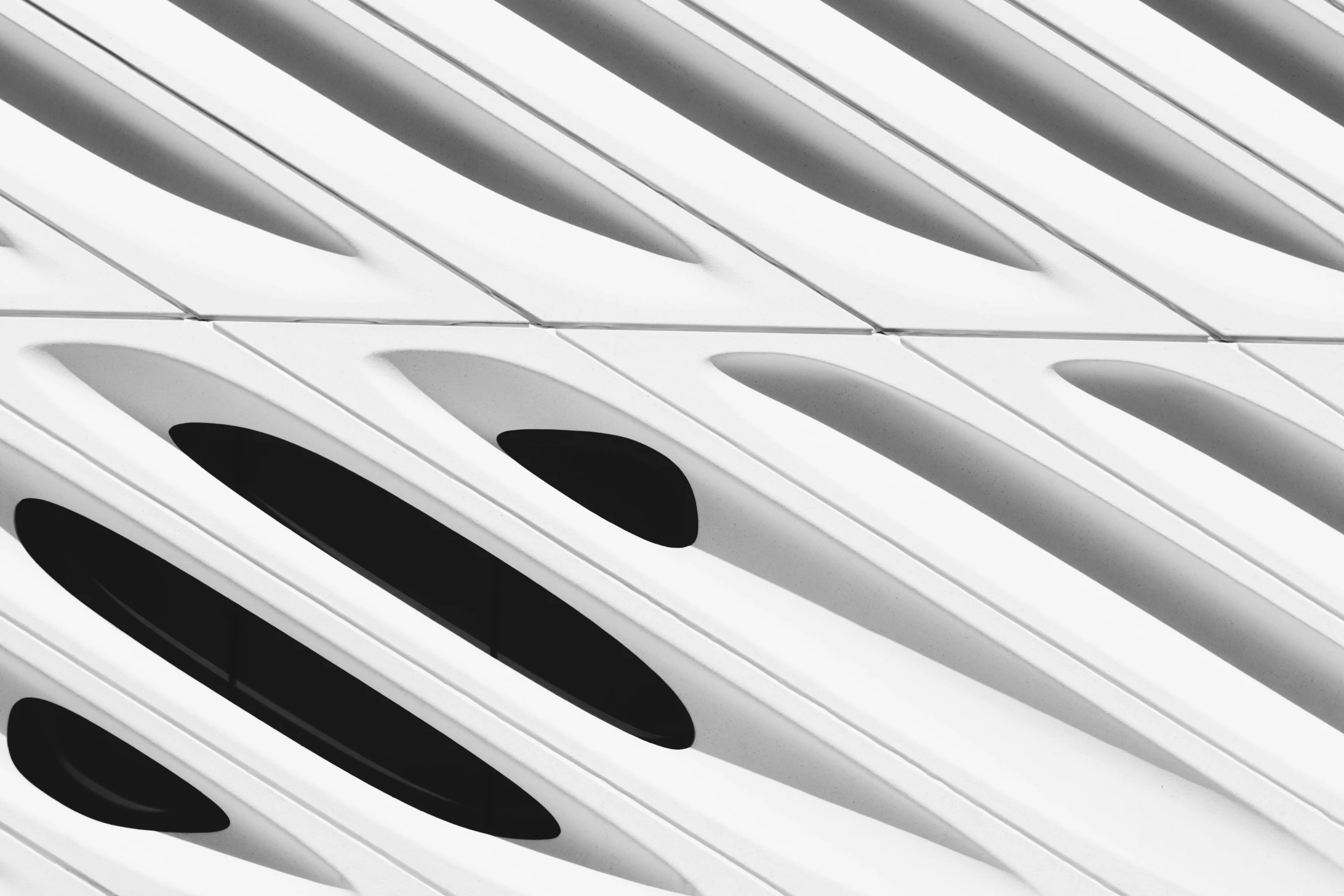 a black and white photo of a building, inspired by Zaha Hadid, pexels contest winner, op art, white plastic armour, closeup, white, vent