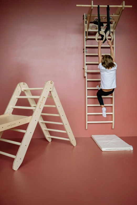 a little girl climbing up a wooden ladder, inspired by Constantin Hansen, unsplash, conceptual art, with furniture overturned, sports setting, product view, panels