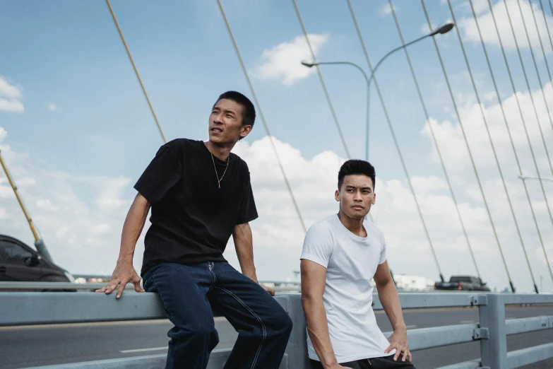 two men standing next to each other on a bridge, a portrait, inspired by Gang Hui-an, pexels contest winner, casual pose, concert, ross tan, icon