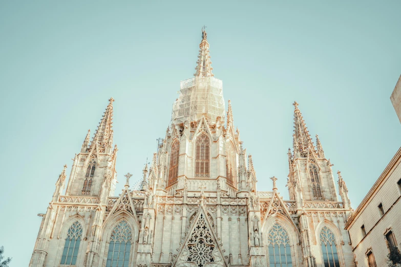 a very tall cathedral with a clock tower, inspired by Modest Urgell, unsplash contest winner, symmetrical crown, sunfaded, barcelona, 2 0 2 2 photo