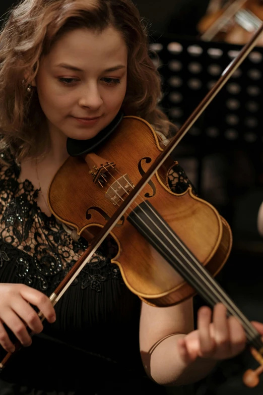 a woman in a black dress playing a violin, wlop and andrei riabovitchev, square, with intricate details, student