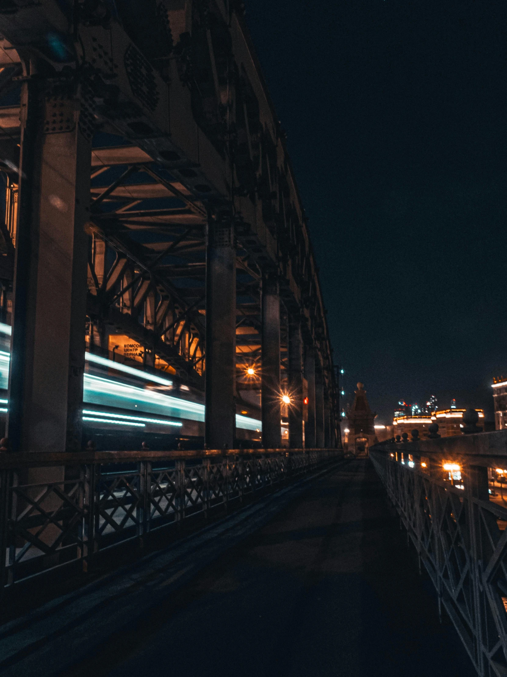 a train traveling over a bridge at night, inspired by Sydney Carline, unsplash contest winner, 4k photo”, hyperrealistic”