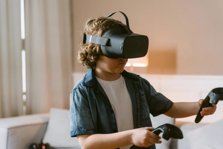 a young boy playing with a video game controller, trending on pexels, interactive art, oculus quest 2, avatar image, navy, studying a hell open rift portal