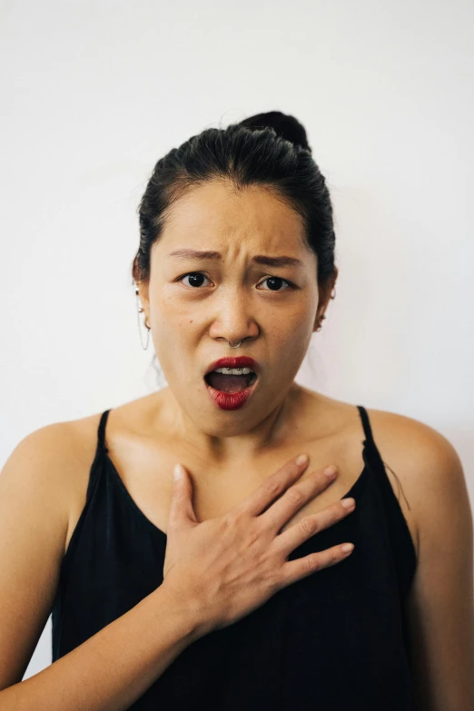 a woman with a surprised look on her face, pexels contest winner, scales on her chest, asian descent, flowing mucus, square