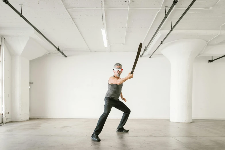 a woman holding a baseball bat in a room, by Nina Hamnett, temporary art, practising sword stances, seattle, chainsaw sword, julian ope