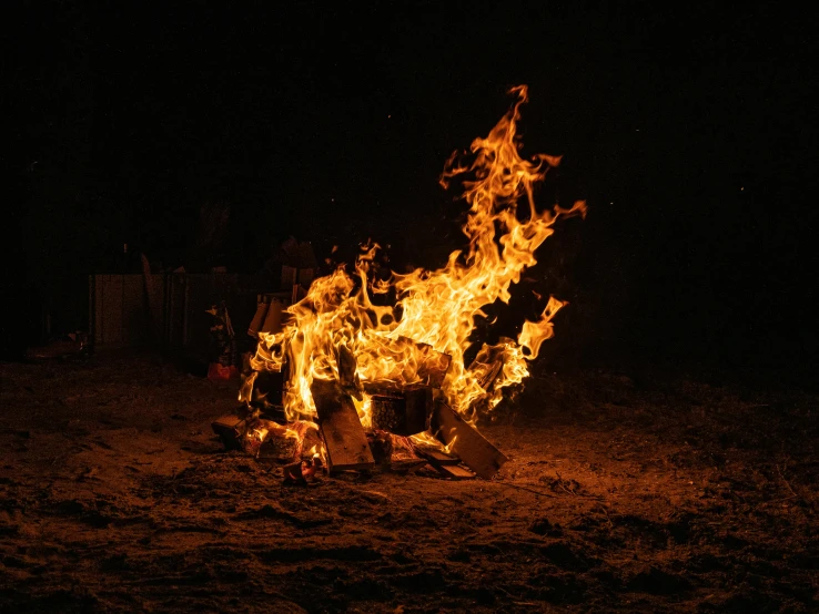 a bonfire is lit up in the dark, pexels contest winner, rust and dust and fire and dirt, photograph taken in 2 0 2 0, instagram post, fuming effigy