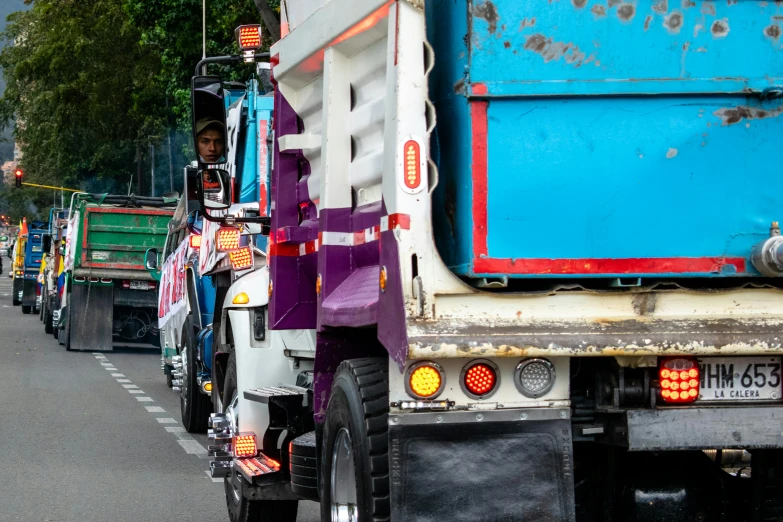 a group of people riding on the back of a truck, pexels contest winner, photorealism, garbage wheel bin, south jakarta, thumbnail, square