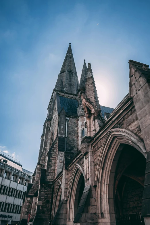 a very tall building with a very tall tower, by Daniel Seghers, unsplash, romanesque, paisley, flying buttresses, marilyn church h, buildings carved out of stone