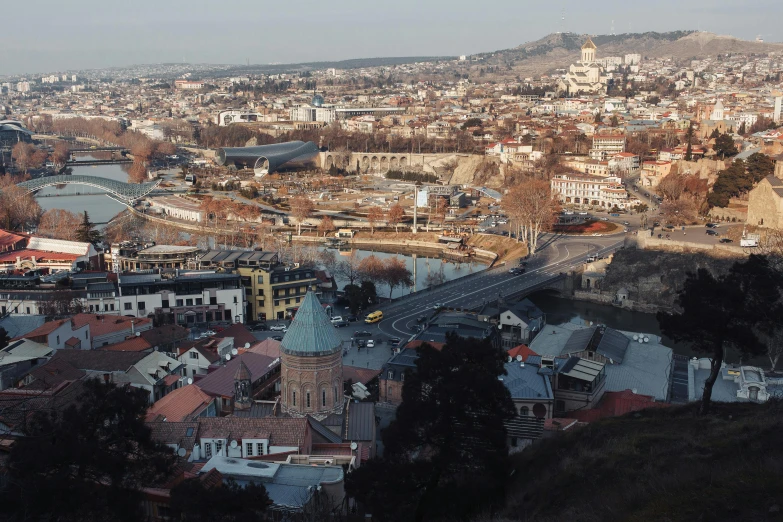 a view of a city from the top of a hill, pexels contest winner, hurufiyya, ayanamikodon and irakli nadar, documentary still, front, overview