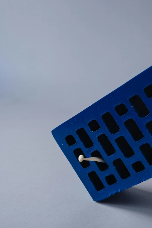 a piece of blue plastic with holes on it, unsplash, suprematism, chewing on a graphic card, simple brutalist architecture, lattice, 15081959 21121991 01012000 4k