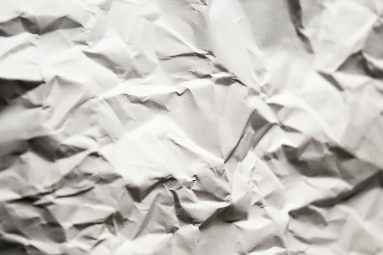 a black and white photo of crumpled paper, by Adam Marczyński, unsplash, made out of shiny white metal, realistic details, delicious, background image