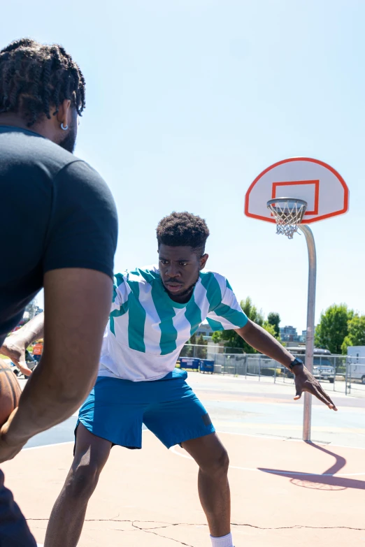 a group of young men playing a game of basketball, trending on dribble, thumbnail, press shot, square, jaylen brown