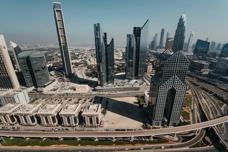 a large city filled with lots of tall buildings, pexels contest winner, hurufiyya, foster and partners, arabic, high resolution, cinematic”