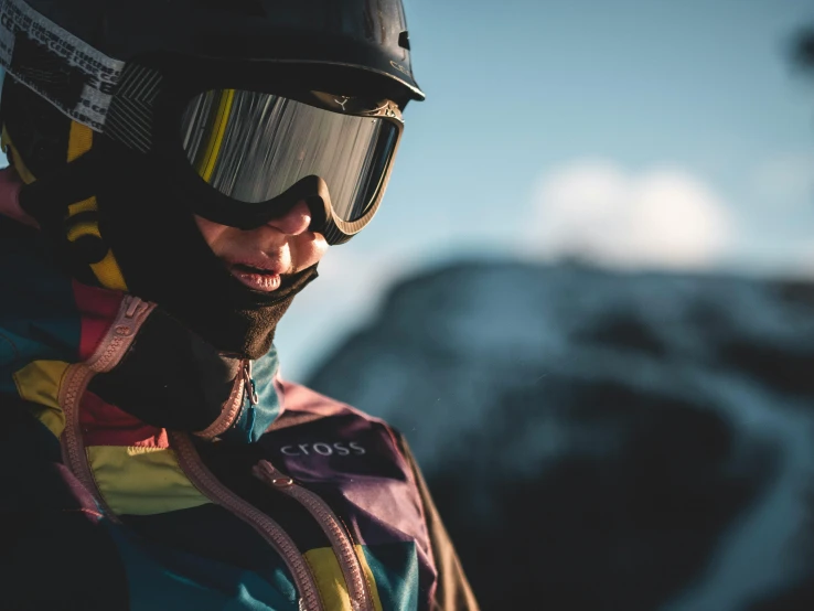 a close up of a person wearing a helmet and goggles, a picture, by Tobias Stimmer, pexels contest winner, on the mountain, robe. perfect faces, multi - coloured, thumbnail